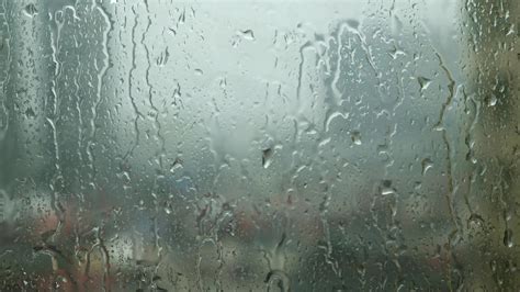 Raindrops Trickling Down On Window Glass During Heavy Rain 2020102