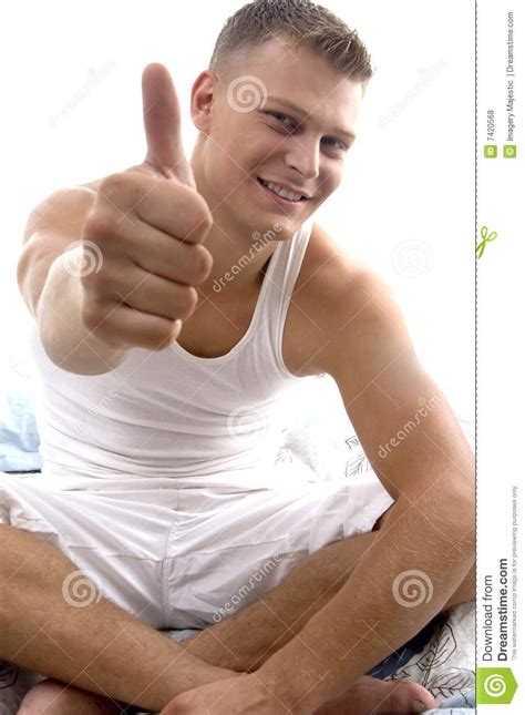 Sitting Young Man Showing Thumb Up Stock Photo Image Of Isolated