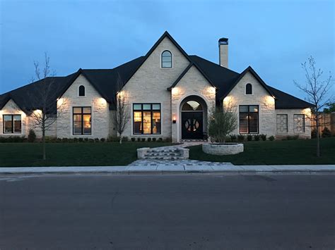 Homes, and is located in the community of the eagle glen at describes this home as brick and stone accent exterior with contemporary, open plan interior. White stone with black trim | Stone exterior houses, Brick ...