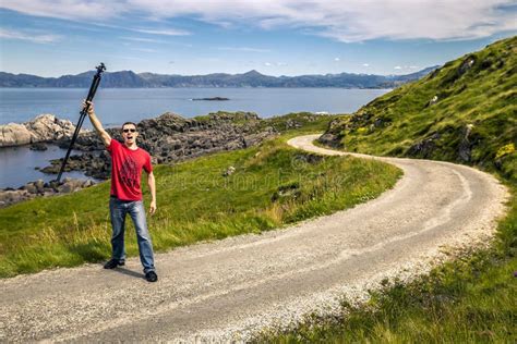 Young Man Is Standing On The Countryside Road Norway Stock Photo