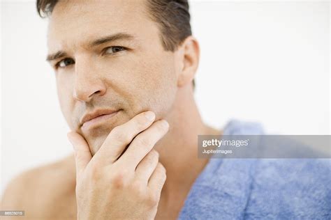 Man Touching Face High-Res Stock Photo - Getty Images