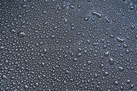 Drops Drips Blobs Beads Dribbles Of Water On The Black Teflon Surface Stock Image Image Of