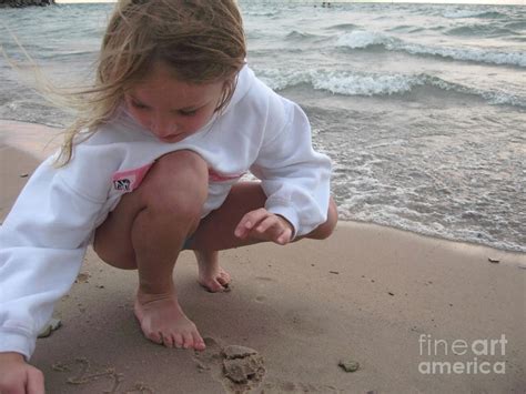 Little Girl Drawing In The Sand By The Water Photograph By Christopher