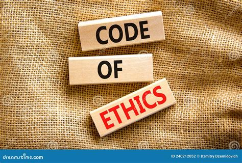 Code Of Ethics Symbol Concept Words Code Of Ethics On Wooden Blocks On A Beautiful Canvas Table