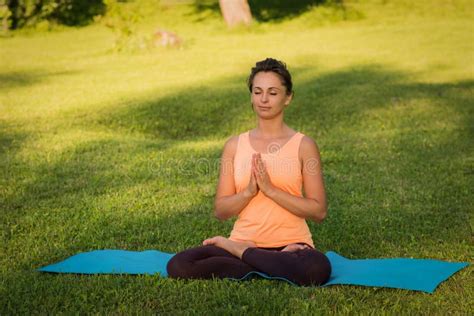 Girl Doing Yoga Outdoors Stock Photo Image Of Woman 129616158