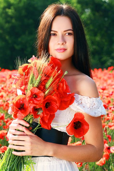 beauty woman in poppy field in white dress in a sunny summer day poppy field poppies flower