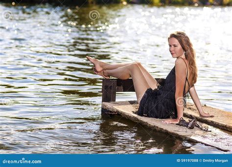 Sensual Caucasian Blond Woman Sitting On Pier Near Water R Stock Photo Image Of Person
