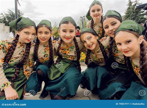 Unidentified Girls In Traditional Georgian Costumes Posing In Crowd Of