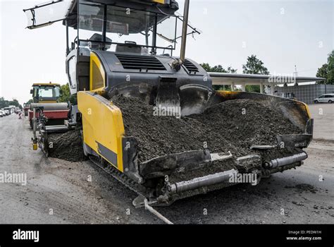Asphalt Paver Machine During Road Construction And Repairing Works A