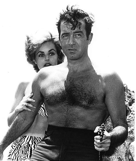 A Shirtless Man And Woman Standing Next To Each Other