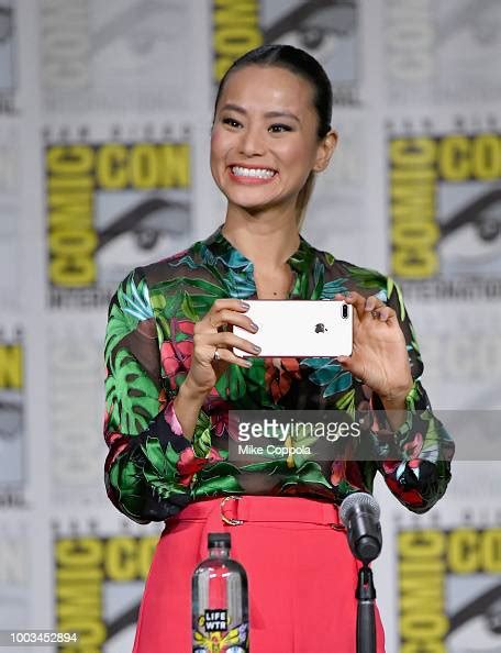 Jamie Chung Takes A Photo Onstage At The The Ted Panel During