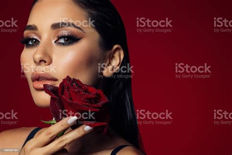 Beautiful Woman Holding Red Rose Stock Photo Download Image Now