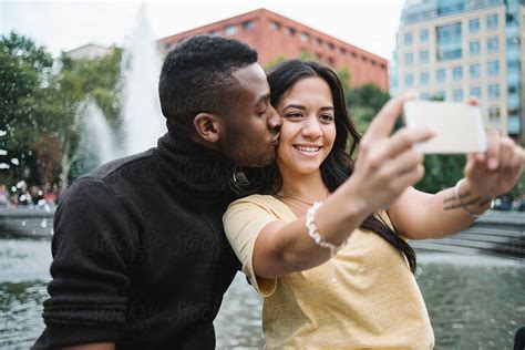 Couple Taking A Selfie In The City By Stocksy Contributor Simone