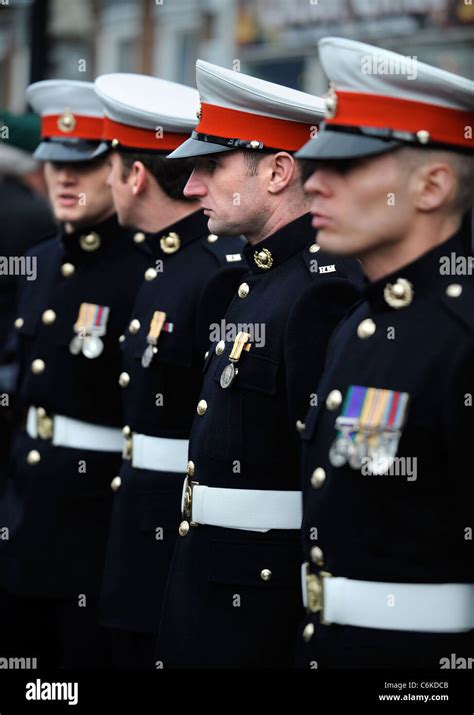Royal Marines In Dress Uniform Amongst Mourners Gathered For A