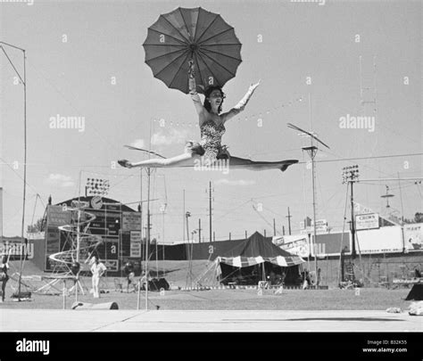 Female Acrobat Doing Splits On Tightrope Stock Photo Alamy