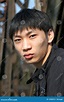 Giovane uomo asiatico fotografia stock. Immagine di asia - 1090810