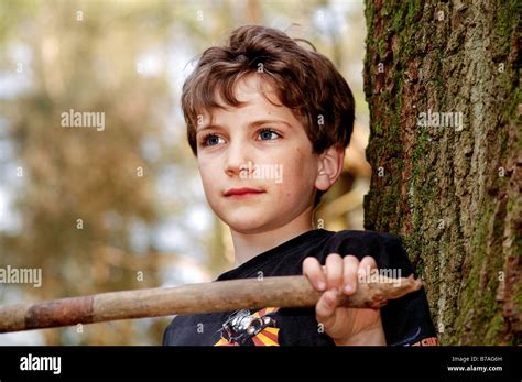 Portrait Of Cute Boy In The Woods Stock Photo Alamy