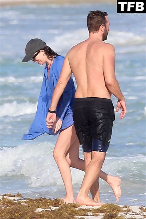 Dakota Johnson And Chris Martin Display Their Beach Ready Bodies While
