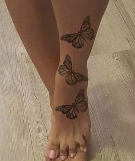 butterflies tattoo in 2021 henna tattoo foot butterfly ankle tattoos butterfly foot tattoo
