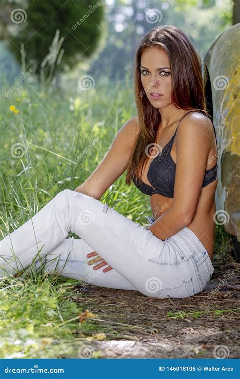 Lovely Brunette Bikini Model Posing Outdoors In A Rural Environment