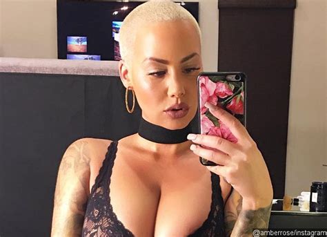 Amber Rose Flaunts Ample Cleavage In Body Baring Jumpsuit See The Pic