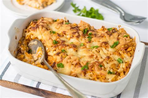 Mix in the cream of chicken soup, then the crushed tomatoes, then the black beans, corn, colby jack cheese and shredded chicken together. Dorito Chicken Casserole Recipe