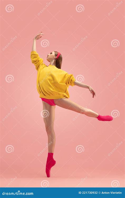 Flexible Young Beautiful Girl Female Ballet Dancer Training Isolated Over Pink Background