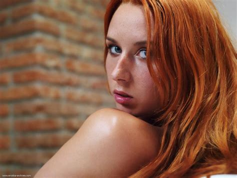 With Stunning Blue Eyes And Long Red Hair This Redhead Is Sure To Steal