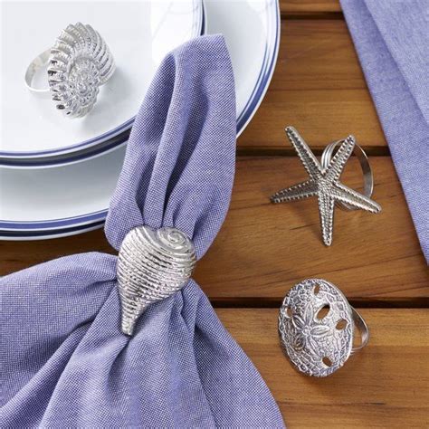 An Array Of Silver Seashells Adorns These Classic Napkin Rings For A