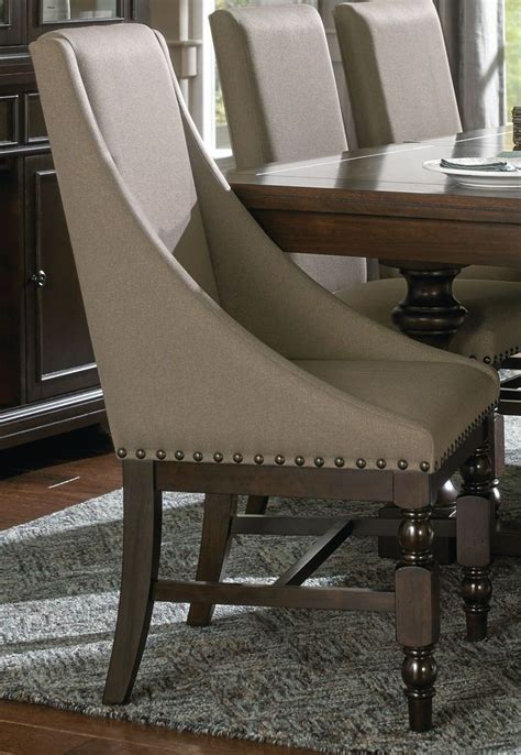 The nailhead trim gives it a traditional feel, yet the nailheads are spread way out, something i don't normally see on a strictly traditional chair. REID CHERRY FINISH DINING SET WITH SELF STORING LEAF AND ...