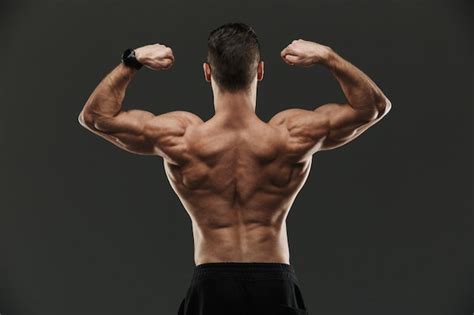 Premium Photo Bodybuilder Flexing Back And Biceps Muscular Athlete