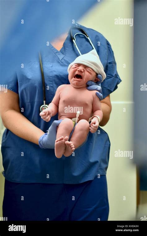 Newborn Baby Being Checked Out Immediately After Birth Stock Photo Alamy