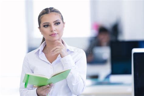 Portrait Of Busy Secretary Looking At Camera Stock Photo Image Of