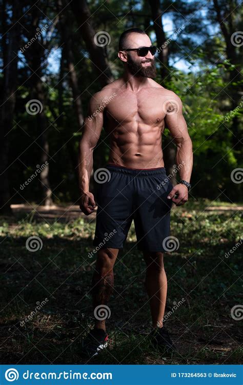 Portrait Of Muscular Man Standing Strong Outdoors Stock Image Image