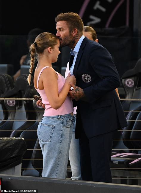 David Beckham Kisses Daughter Harper On The Head While Victoria Snaps