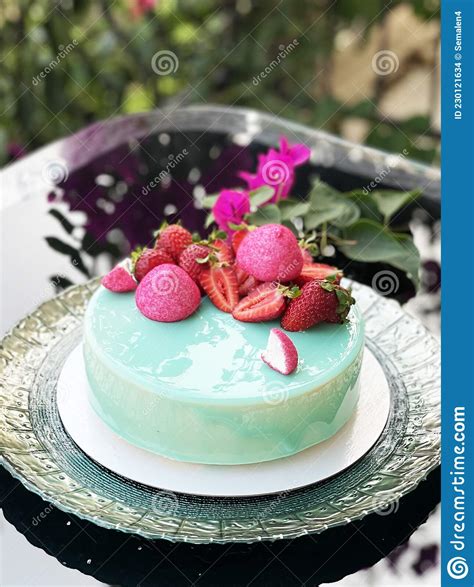 A Beautiful Delicious Mousse Cake On A Mirrored Table Juicy