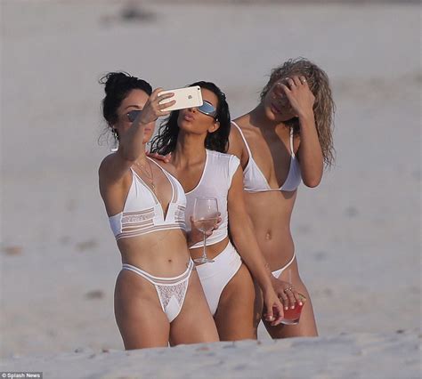 Kim Kardashian Shows Off Her Impressive Assets In Wet Shirt As She Frolics On Beach In Mexico