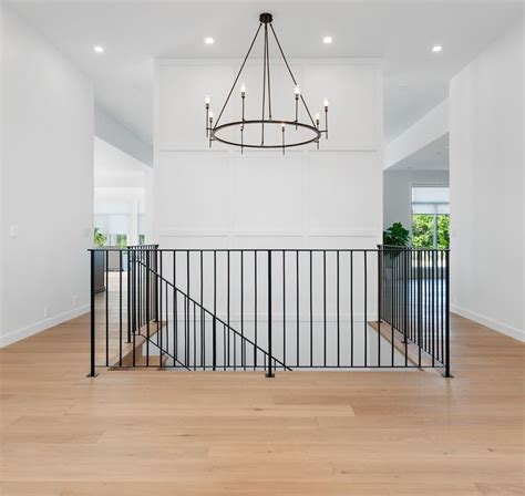 Consider pairing wrought iron railing with other wood stair parts, like handrail, treads, box newels, or turned newels. Liberty- Interior Design Portfolio, Winnipeg. Modern Black Staircase Design. | Design, Interior ...