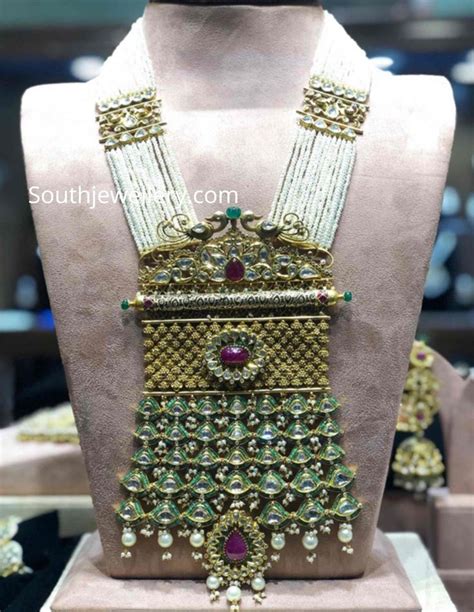 Multi Strand Pearl Necklace With Kundan Side Motifs And Big Antique