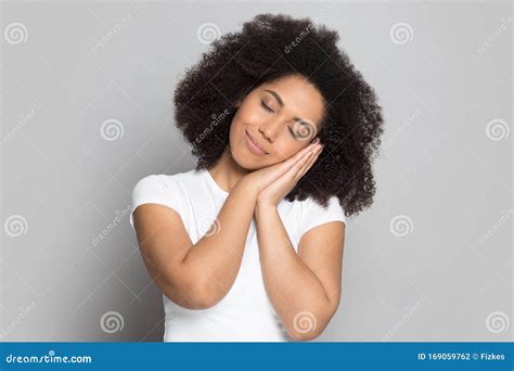 Tired African American Millennial Lady Put Head On Folded Hands Stock