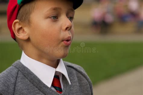 Close Up Of Uniformed Schoolboy Blowing Out Cheeks Stock Image Image