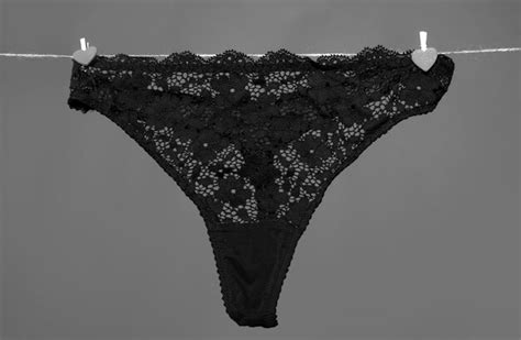 Premium Photo Womans Erotic Black Underwear Panties Hanging On Rope