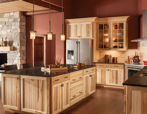 A kitchen remodel done using lowes white cabinets and glass backsplash. hickory kitchen cabinets lowes - Home Decor