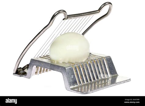 Vintage Aluminium Egg Slicer With Hard Boiled Chicken Egg Isolated On White Background Stock