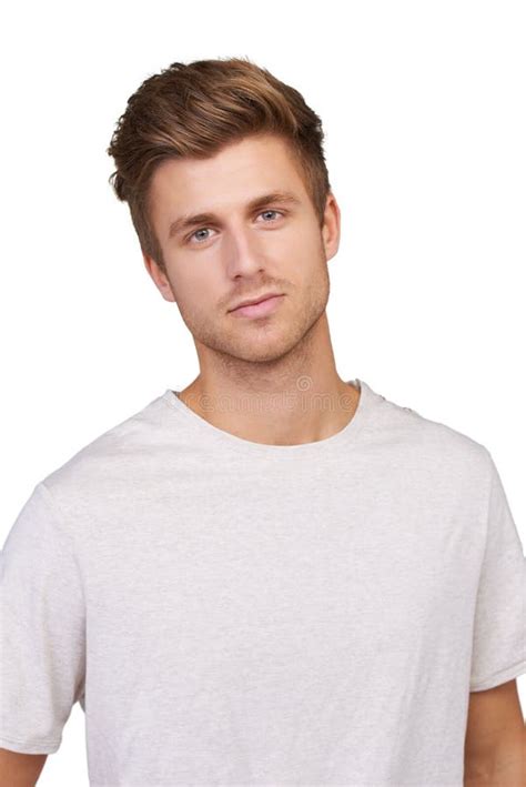 Portrait Of A Handsome Young Man In A White Shirt On A Blue Background