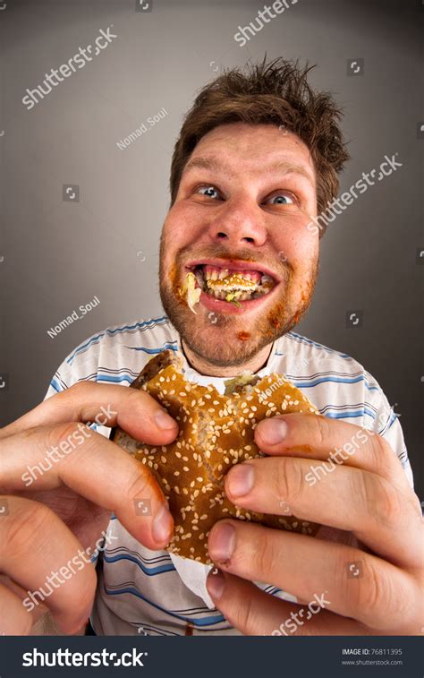 Portrait Expressive Fat Man Chewing Hamburger Stock Photo