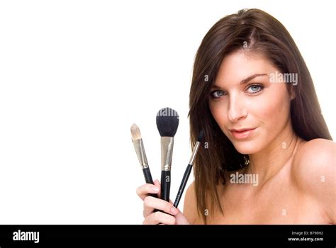 Woman Holding A Set Of Make Up Brushes Stock Photo Alamy