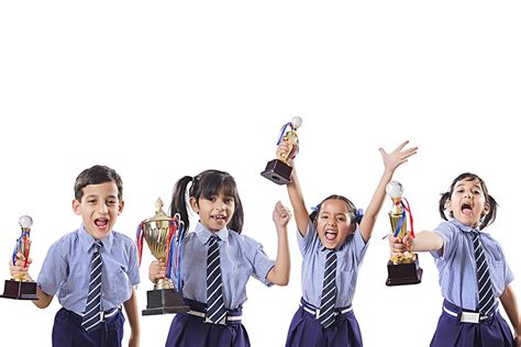 Happy Shouted Four School Kids Students Friends Holding Victory Trophy