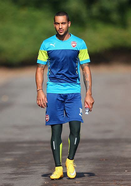 Theo Walcott Of Arsenal Walks Out For Training During An Arsenal