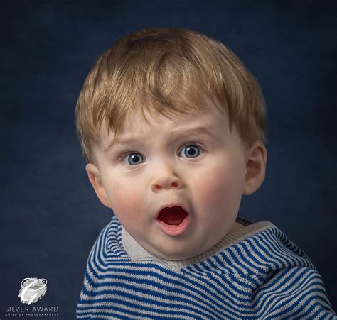 Studio Portrait Of A Super Cute Little Boy With A Shocked Expression By